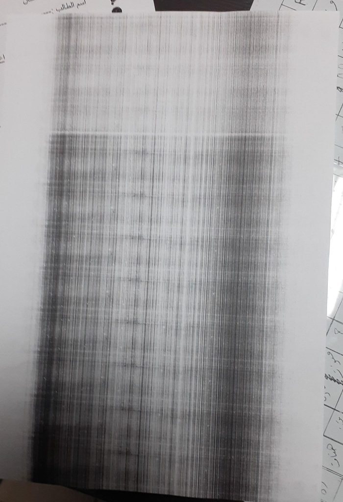 Black and dark streaks on printed page